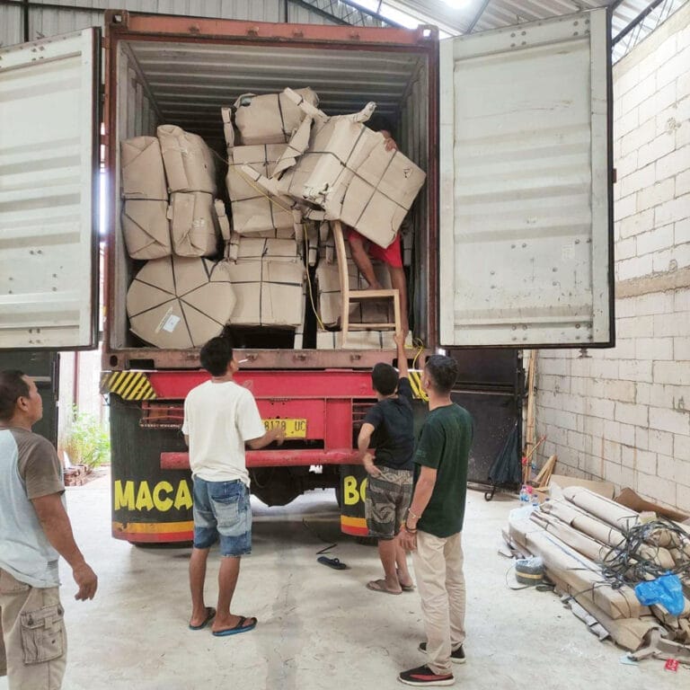 QC staff overseeing loading of container